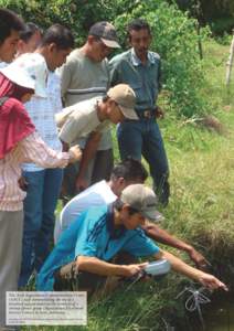 The Aceh Aquaculture Communication Centre (AACC) staff demonstrating the use of a dissolved oxygen meter to the members of a shrimp farmer group (Aquaculture Livelihood Service Centre) in Aceh, Indonesia. Courtesy of AAC