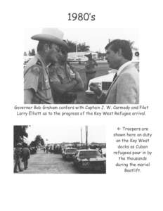 1980’s  Governor Bob Graham confers with Captain J. W. Carmody and Pilot Larry Elliott as to the progress of the Key West Refugee arrival.  Troopers are shown here on duty