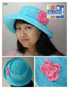 F003  CROCHETED EASTER BONNET w/FLORAL EMBELLISHMENT SIZE: Hat = 22” around head and 7” across top. Flower = 4” at widest point. MATERIALS: Lily Chin Signature Collection “Harlem” (52% cotton, 48% acrylic, 50g