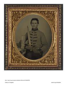 Private Henry Augustus Moore of Co. F, 15th Mississippi Infantry Regiment, with artillery short sword and sign reading Jeff Davis and the South!