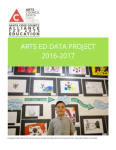 ARTS ED DATA PROJECTThird grade Artist Teacher Partnership student, proudly standing in front of his artwork at the county-wide children’s art exhibit.  SANTA CRUZ COUNTY ARTS ED DATA PROJECT