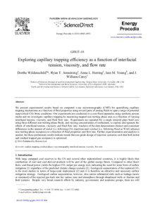 Exploring capillary trapping efficiency as a function of interfacial tension, viscosity, and flow rate